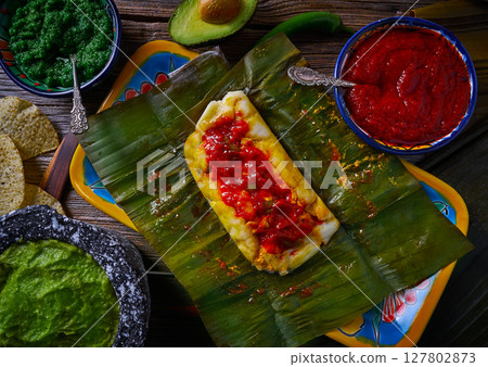 Tamale Mexican recipe with banana leaves 127802873
