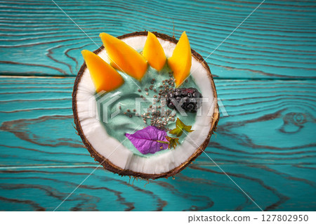 Spirulina bowl smoothie in coconut blackberry mango 127802950