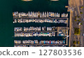 Drone top-down view of many boats and yachts moored in the Port of Marseille, France, showing clear water, docks, and marina layout. 127803536
