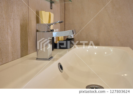 Explore trends in Modern Bathroom Faucet and Tub Design, focusing on elegance and style 127803624