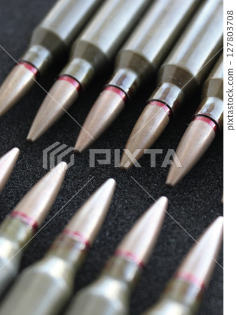 Live Ammunition In Head To Head Order On Black Velvet Upholstery Closeup Live Ammunition In Head To Head Order On Black Velvet Upholstery Closeup 127803708