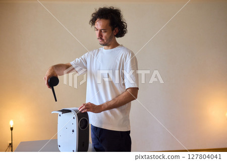 How To Effectively Clean a Portable Air Purifier Filter Utilizing a Vacuum Cleaning Tool 127804041