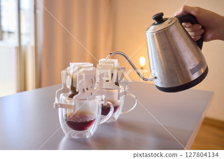 Pouring Coffee Using a Distinct and Unique Brewing Method for Enhanced Enjoyment With Artistry Pouring Coffee Using a Distinct and Unique Brewing Method for Enhanced Enjoyment With Artistry 127804134