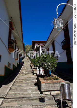Famous beautiful Street of the Scales at the Heritage Town of Jerico located in the Department of Antioquia in Colombia. Famous beautiful Street of the Scales at the Heritage Town of Jerico located in the Department of Antioquia in Colombia. 127804631
