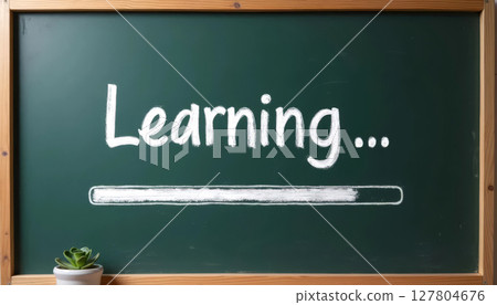 Chalkboard with loading bar and Learning... text, creative symbol of back to school and new academic year start. 127804676