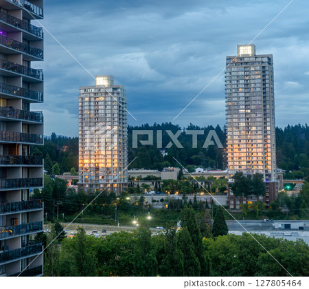 Sunset reflection in windows of high-rise buildings at Lougheed City Center 127805464