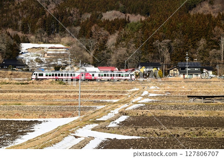 The Kamaishi Line as seen from the rice paddies around the roadside station Tono Kaze no Oka 127806707