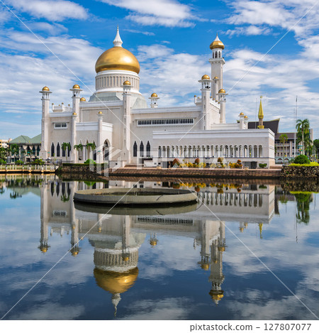 Omar Ali Saifuddien Mosque stands majestically in Bandar Seri Begawan, Brunei, against a bright blue sky 127807077