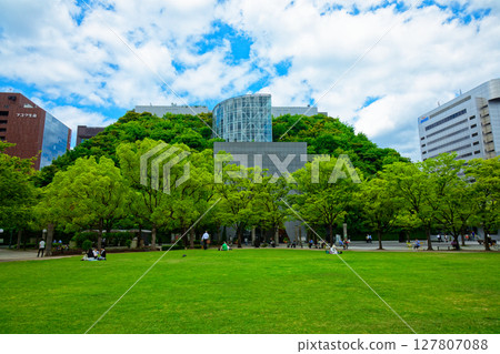 Tenjin Central Park and Acros Fukuoka with young leaves and fresh greenery 127807088