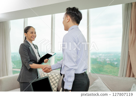 Business professionals are actively engaged in a productive and beneficial meeting Business professionals are actively engaged in a productive and beneficial meeting 127807119