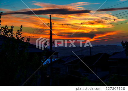 Beautiful sunset after the rain Golden clouds piled up like millefeuille on the mountainside after sunset⑤ 127807128
