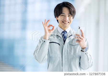 A young man working on clothes A young man working on clothes 127807336