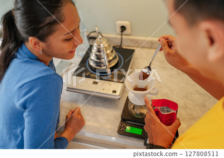 Brewing Coffee Together Enjoying a Couples Coffee Experience at Home Together 127808511