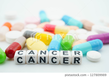 Cancer word with pills and capsules medical drug. 127809989