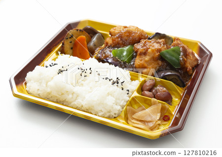 Lunch box with fried chicken on a white background Lunch box with fried chicken on a white background 127810216