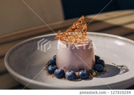artisan panna cotta dessert on a plate, fine dining cuisine concept 127810284