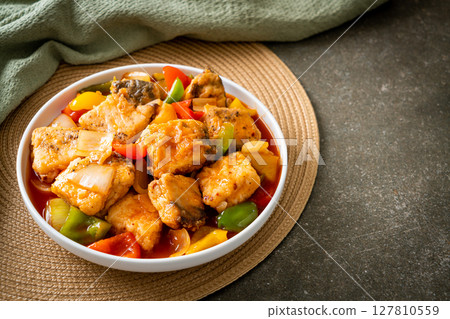 fish stew with tomato and pepper 127810559