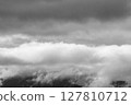 Monochrome sea of clouds over the mountain top after the rain 03 127810712