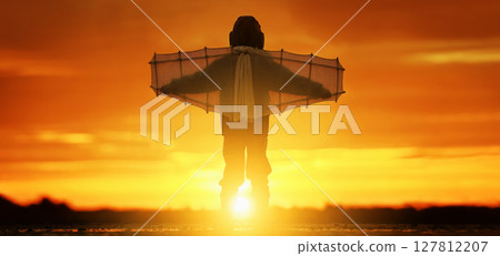 Little boy with wings at sunset imagines himself a pilot and dreams of flying. Little boy with wings at sunset imagines himself a pilot and dreams of flying. 127812207
