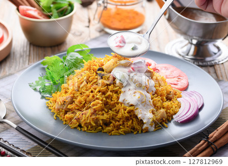 Indian food Chicken Biryani and Raita (Indian style yogurt salad) 127812969