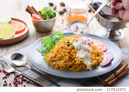 Indian food Chicken Biryani and Raita (Indian style yogurt salad) 127812972
