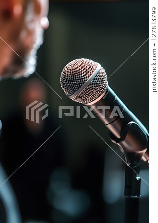 freelancer adjusting microphone before hosting online presentation freelancer adjusting microphone before hosting online presentation 127813799