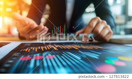 a businessman analyzing an AI dashboard with predictive graphs in a modern office 127813822