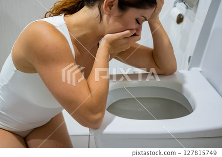 Caucasian woman suffers from toxicosis.  127815749