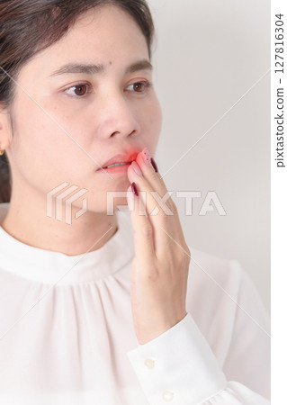 Business woman having Mouth ache for concepts of Mouth Ulcer Sore, Aphthous Stomatitis, Oral Lesions, Halitosis, Oral Health Care, Toothache and Gum Disease, Dental Caries, Gingivitis and Periodontal Business woman having Mouth ache for concepts of Mouth Ulcer Sore, Aphthous Stomatitis, Oral Lesions, Halitosis, Oral Health Care, Toothache and Gum Disease, Dental Caries, Gingivitis and Periodontal 127816304
