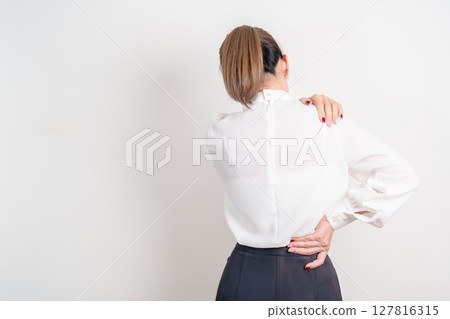 Business woman having back body ache for concepts of Back Muscle Strain, Piriformis Syndrome, Low Back Pain, Lumbar Disc Degeneration, Herniated, Osteoporosis, Spinal Compression and Office syndrome Business woman having back body ache for concepts of Back Muscle Strain, Piriformis Syndrome, Low Back Pain, Lumbar Disc Degeneration, Herniated, Osteoporosis, Spinal Compression and Office syndrome 127816315