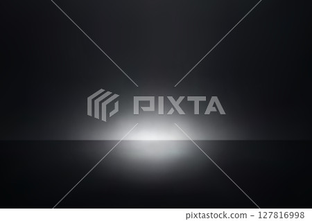 Minimal spotlight over deep black stage background 127816998