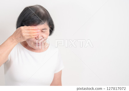 Elderly Woman having Eye pain and Irritation for concepts of Eye disease, Cataract, Glaucoma, Age Related Macular Degeneration, Diabetic Retinopathy, dry eyes, Conjunctivitis, World Glaucoma day 127817072