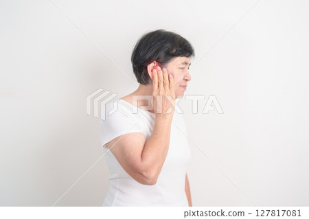 Elderly Woman having Ear pain for concept of Ear disease, Atresia, Otitis Media, Infection, Pertorated Eardrum, Meniere syndrome, Otolaryngologist, Hearing Loss, Hyperacusis, Tinnitus and Earwax 127817081