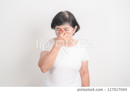 Elderly Woman having Nose pain for concepts of Nose disease, Common Cold, Influenza, Flu, Covid 19, Respiratory Infection, Sinusitis, Allergic Rhinitis, Asthma, Allergy, Dry nose Anosmia and Health Elderly Woman having Nose pain for concepts of Nose disease, Common Cold, Influenza, Flu, Covid 19, Respiratory Infection, Sinusitis, Allergic Rhinitis, Asthma, Allergy, Dry nose Anosmia and Health 127817084