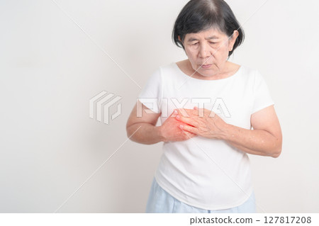 Elderly Woman having Chest pain for concepts of Lung Disease, Lung Cancer, Asthma, Chronic Obstructive Pulmonary or COPD, Bronchitis, Emphysema, Cystic Fibrosis, Bronchiectasis, Pneumonia and Health 127817208