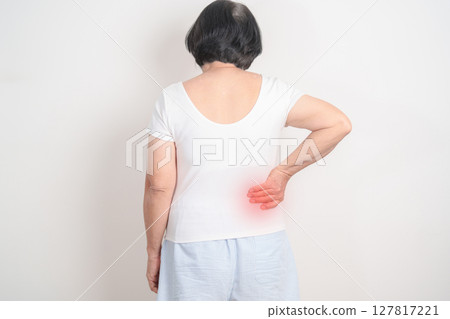 Elderly woman having side and Back Waist pain for Kidney disease, Urinary system and Stones, world Kidney and Cancer day, Chronic kidney, Organ Donor Day and Health care concept Elderly woman having side and Back Waist pain for Kidney disease, Urinary system and Stones, world Kidney and Cancer day, Chronic kidney, Organ Donor Day and Health care concept 127817221