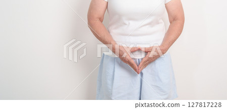 Woman hand heart shape for Ovarian, Uterine and Cervical awareness month cancer, Cervix disorder, Endometriosis, Hysterectomy, Uterine fibroids, Reproductive system and women health concepts 127817228