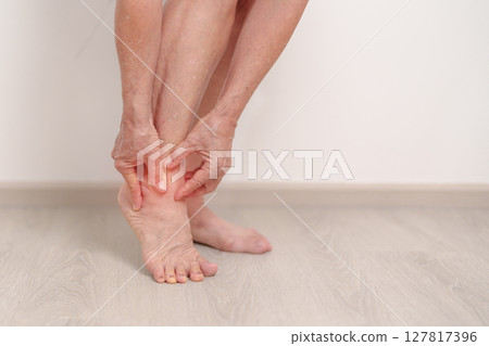 Elderly woman having leg pain due to Ankle Sprains or Achilles Tendonitis and Shin Splints ache. injury, hyperuricemia disease, Gout,Senior Health care and medical treatment  concepts 127817396