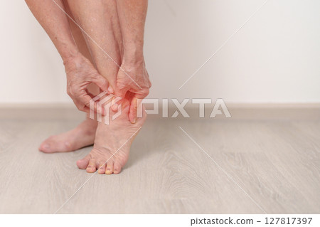 Elderly woman having leg pain due to Ankle Sprains or Achilles Tendonitis and Shin Splints ache. injury, hyperuricemia disease, Gout,Senior Health care and medical treatment  concepts 127817397
