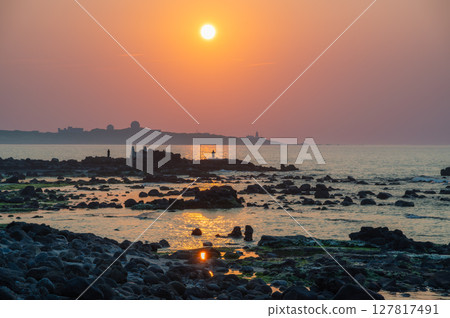 Captivating Sunset at Fuguijiao Lighthouse Coast Shimen New Taipei City. 127817491