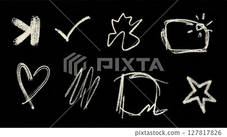 Simple chalk drawings illustrate a range of abstract shapes, including a heart and stars, set against a deep black background, creating a vibrant visual contrast. 127817826
