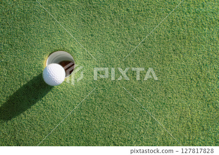 golf ball placed on the green 127817828