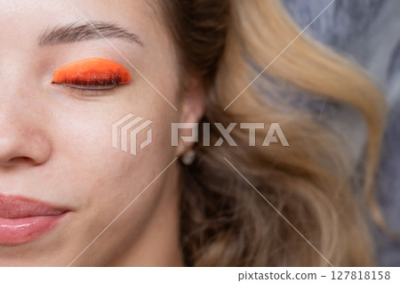 Caucasian woman undergoing eyelash lamination procedure. Top view.  127818158