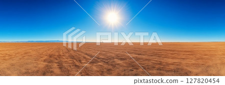 Panoramic view of arid cracked soil under a bright midday sun, with mountains visible on horizon, highlighting the impact of drought and climate change on the environment Panoramic view of arid cracked soil under a bright midday sun, with mountains visible on horizon, highlighting the impact of drought and climate change on the environment 127820454