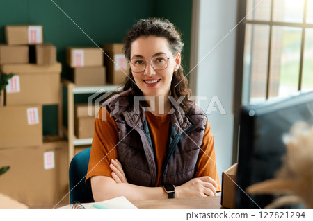 Woman working in a warehouse 127821294