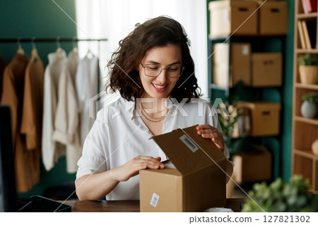 designer is working in studio 127821302