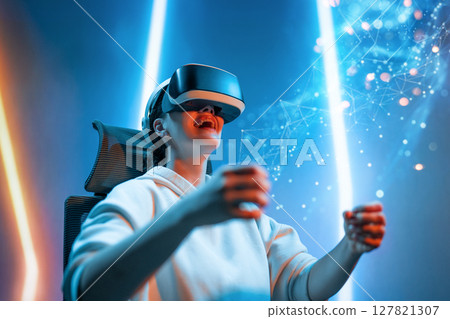 Woman with VR virtual reality goggles Woman with VR virtual reality goggles 127821307