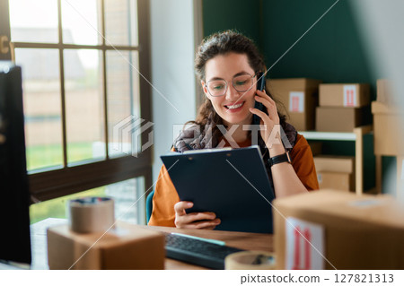 Woman working in a warehouse Woman working in a warehouse 127821313