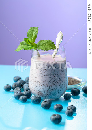 Blueberry smoothie with chia seeds and fresh berries. 127821489