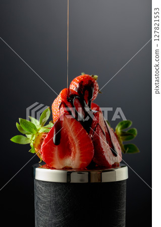 Fresh strawberries and melted dark chocolate. Fresh strawberries and melted dark chocolate. 127821553